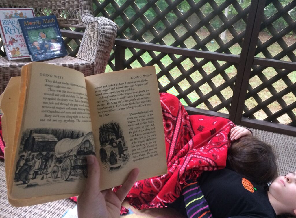 My girls snuggled under a blanket listening to me read aloud.