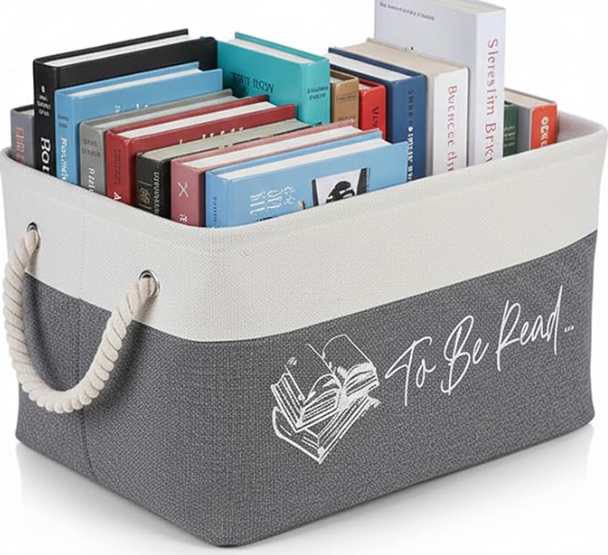 A small basket for books next to the couch.